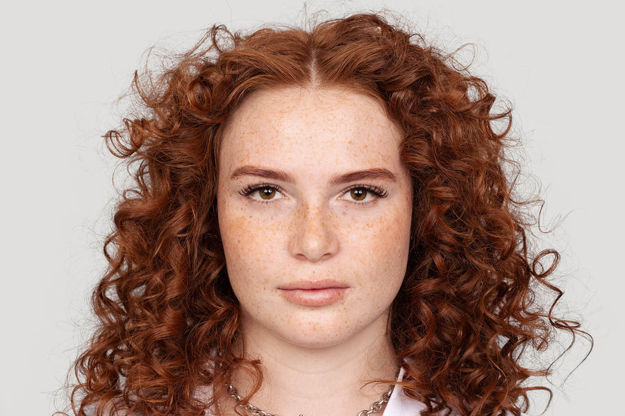 Redhead female with freshly shaped and tinted brows